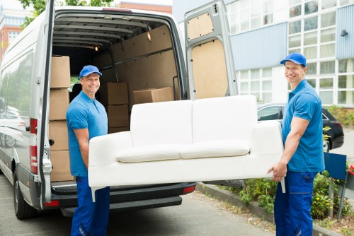 Professional removals van for local removals in Uptonpark on a residential street