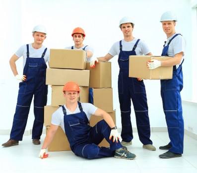 Packed moving boxes and furniture prepared for a home move in Uptonpark