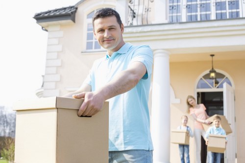 Family home relocation scene with removal team in Uptonpark