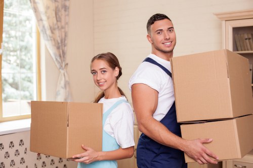 Professional movers handling furniture in Uptonpark